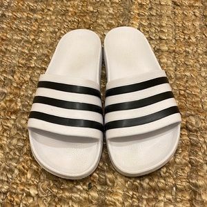 White and black adidas women’s slide sandal